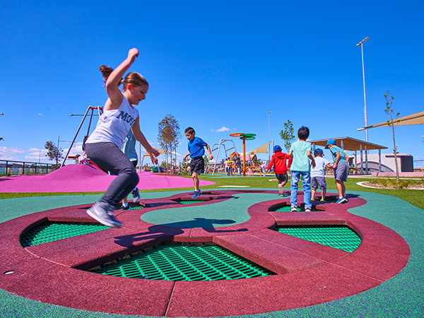 Children playing at Livvi's Place Playground