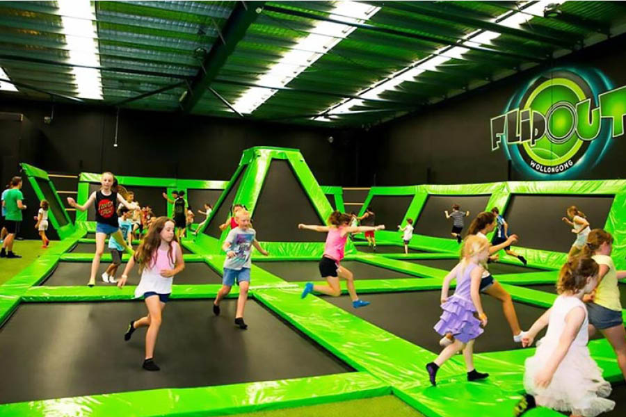 Kids playing on trampolines at Flip Out World