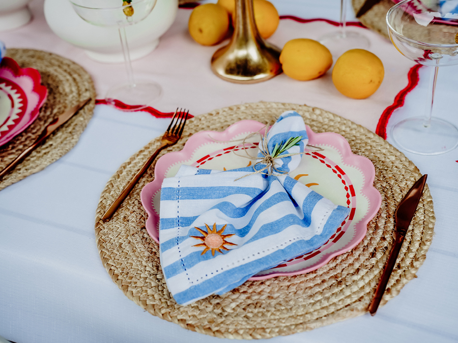 Table styled with placemats, dinner plate, napkin and cutlery