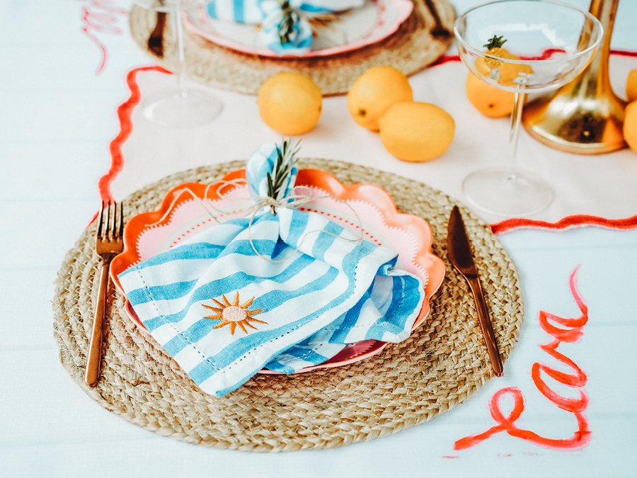 A table styled with placemat, plate, napkin and cutlery