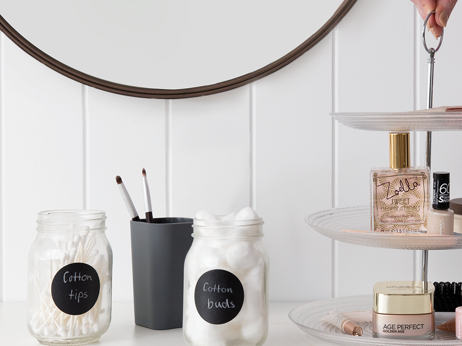 Neatly placed beauty products in jars and on a stand