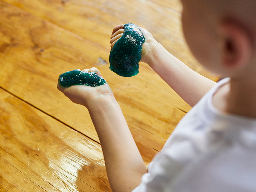 Close up of  a child playing with slime